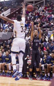 Patrick Cole shoots over NC A&T Defender. Photo by Anthony Ortiz / Echo staff photographer