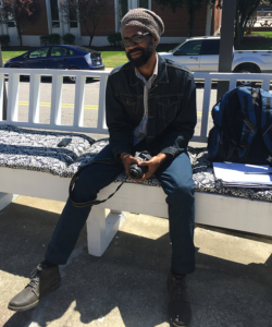 Alumnus Edward Harris, seated outside VSOP hair salon and coffee shop, says he feels a sense of responsibility to inspire students to reach their potential. Photo by Autavius Smith / Campus Echo staff photographer